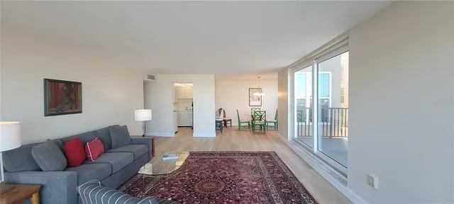 a living room with furniture and a rug