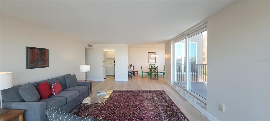 632 Edgewater Drive, Unit 235 Dunedin, FL 34698 - Photo 7 of 37 a living room with furniture and a rug