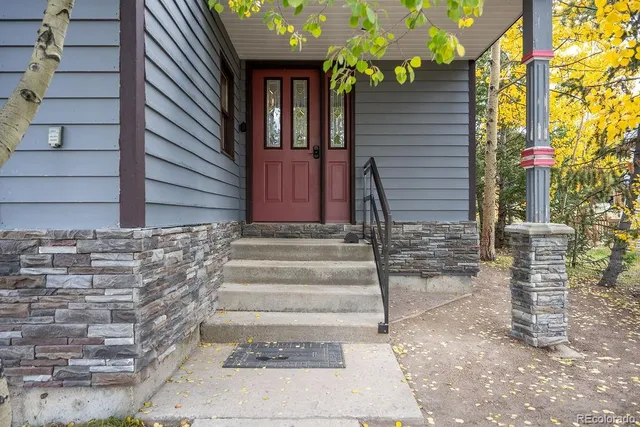 a front view of a house with stairs