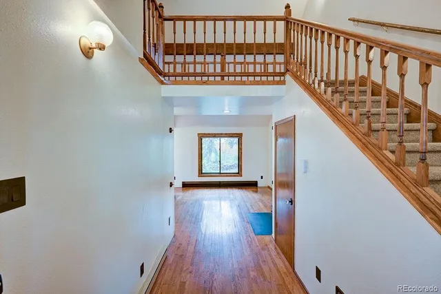 a view of entryway with wooden floor