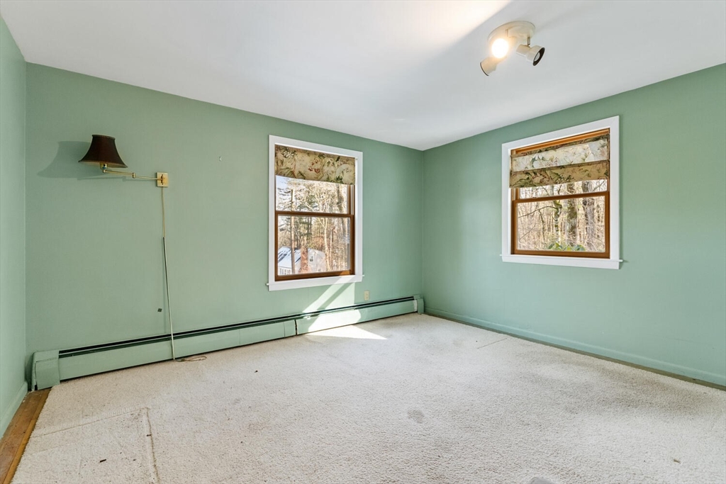 7 Kelley Road Acton, MA 01720 - Photo 9 of 14 a view of an empty room with a window