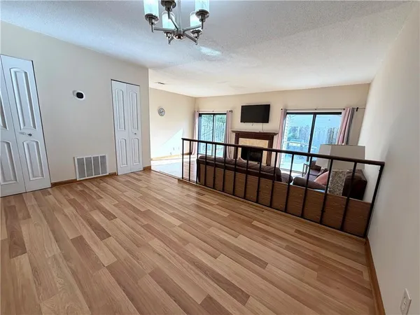a view of a livingroom with furniture and workspace