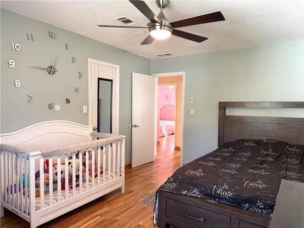 a bed room with a bed and a chandelier