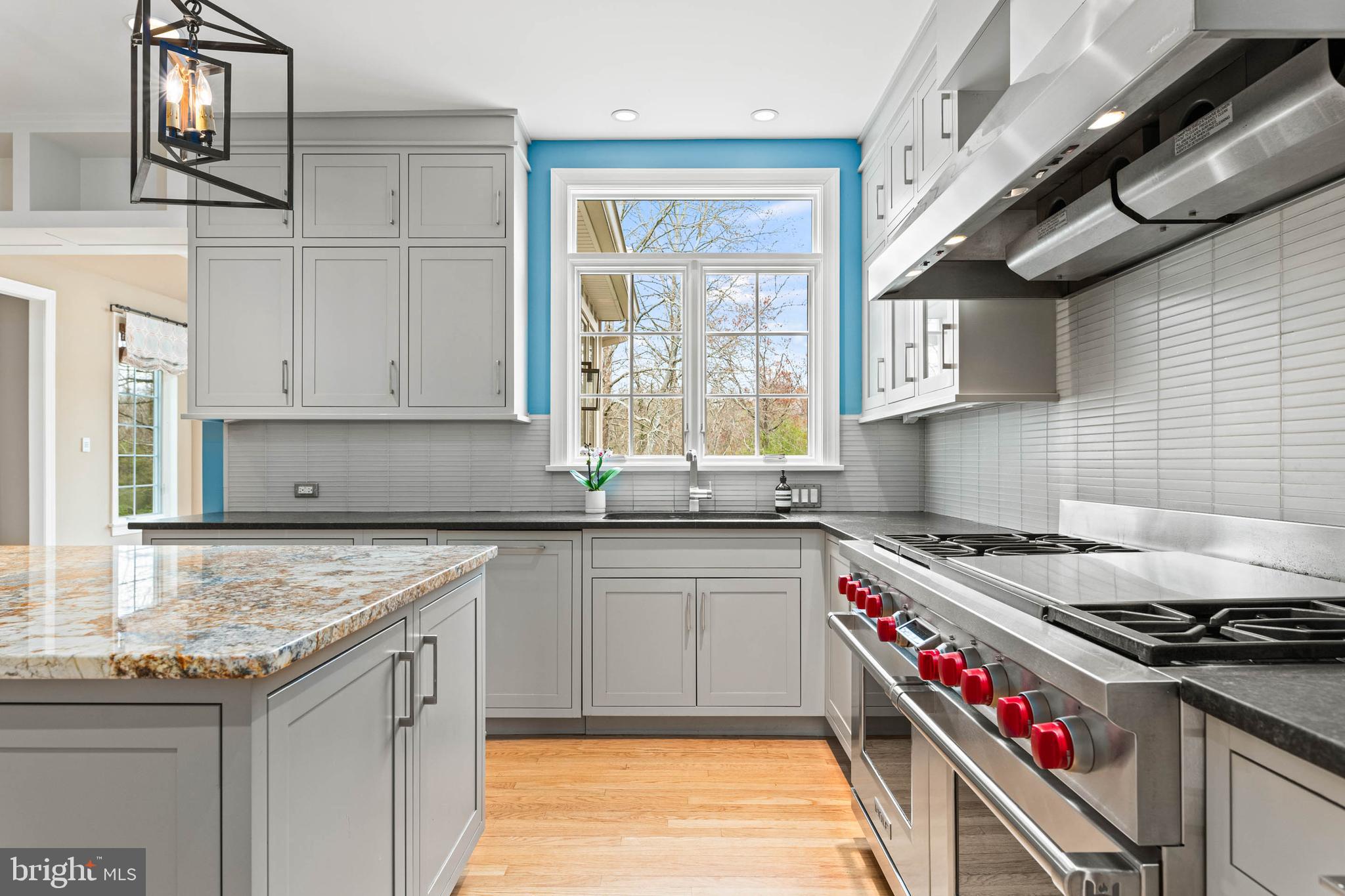 607 Newtown Road Berwyn, PA 19312 - Photo 24 of 83 a kitchen with granite countertop a sink stainless steel appliances and cabinets