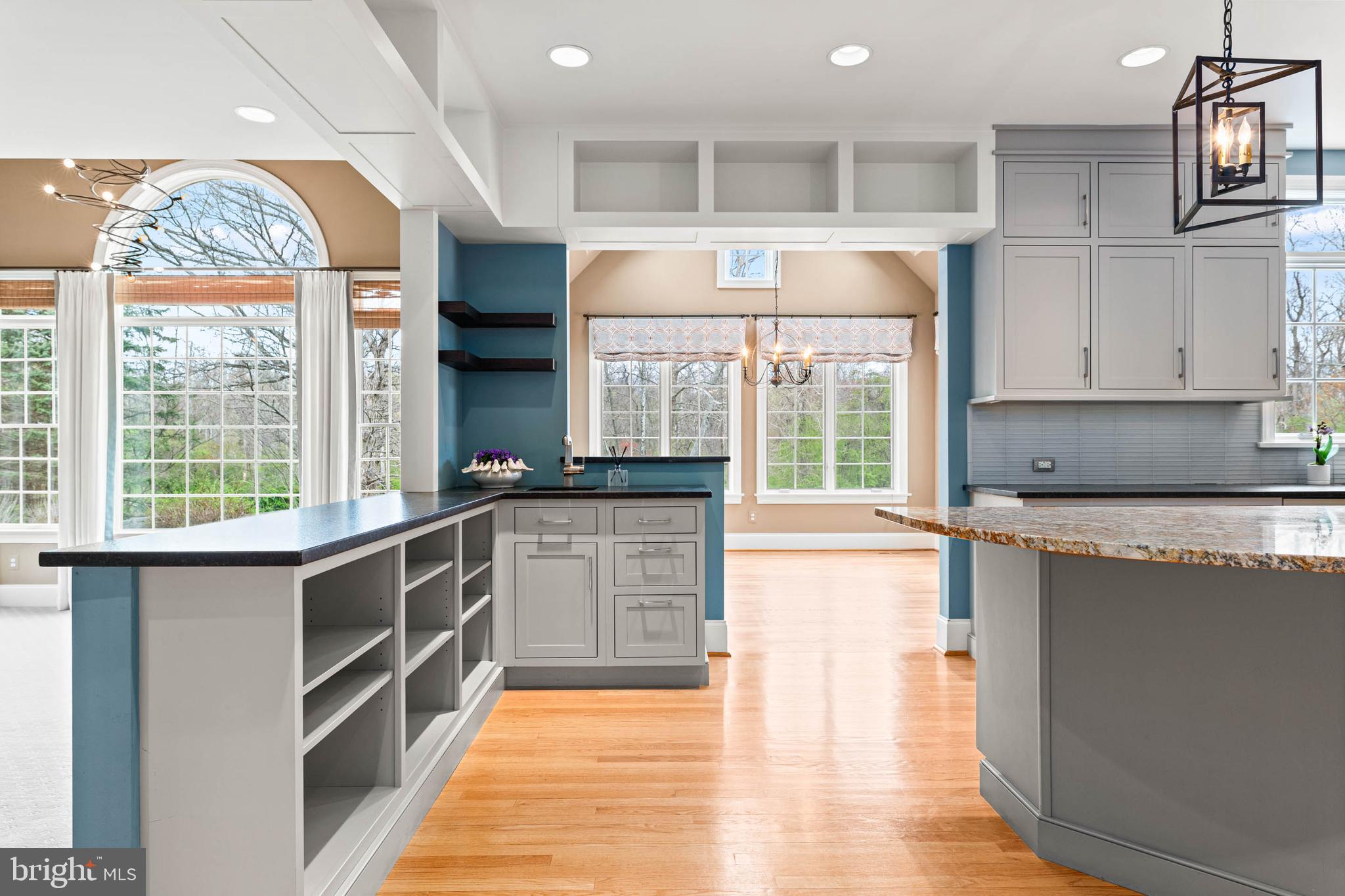 607 Newtown Road Berwyn, PA 19312 - Photo 27 of 83 a kitchen with stainless steel appliances granite countertop a stove a sink and a microwave
