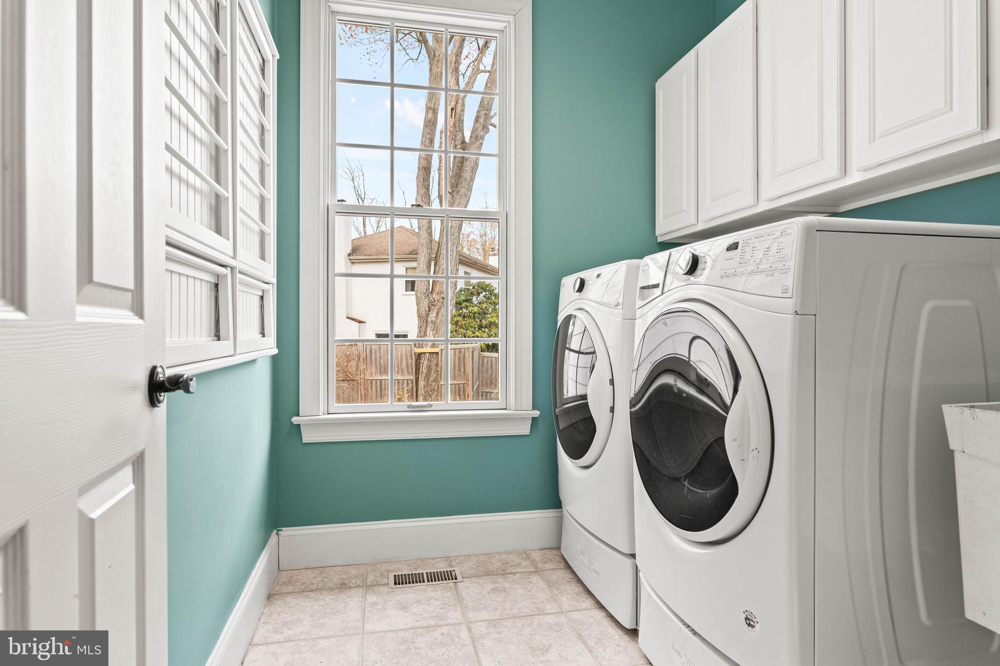 607 Newtown Road Berwyn, PA 19312 - Photo 36 of 83 a view of a hallway with washer and dryer