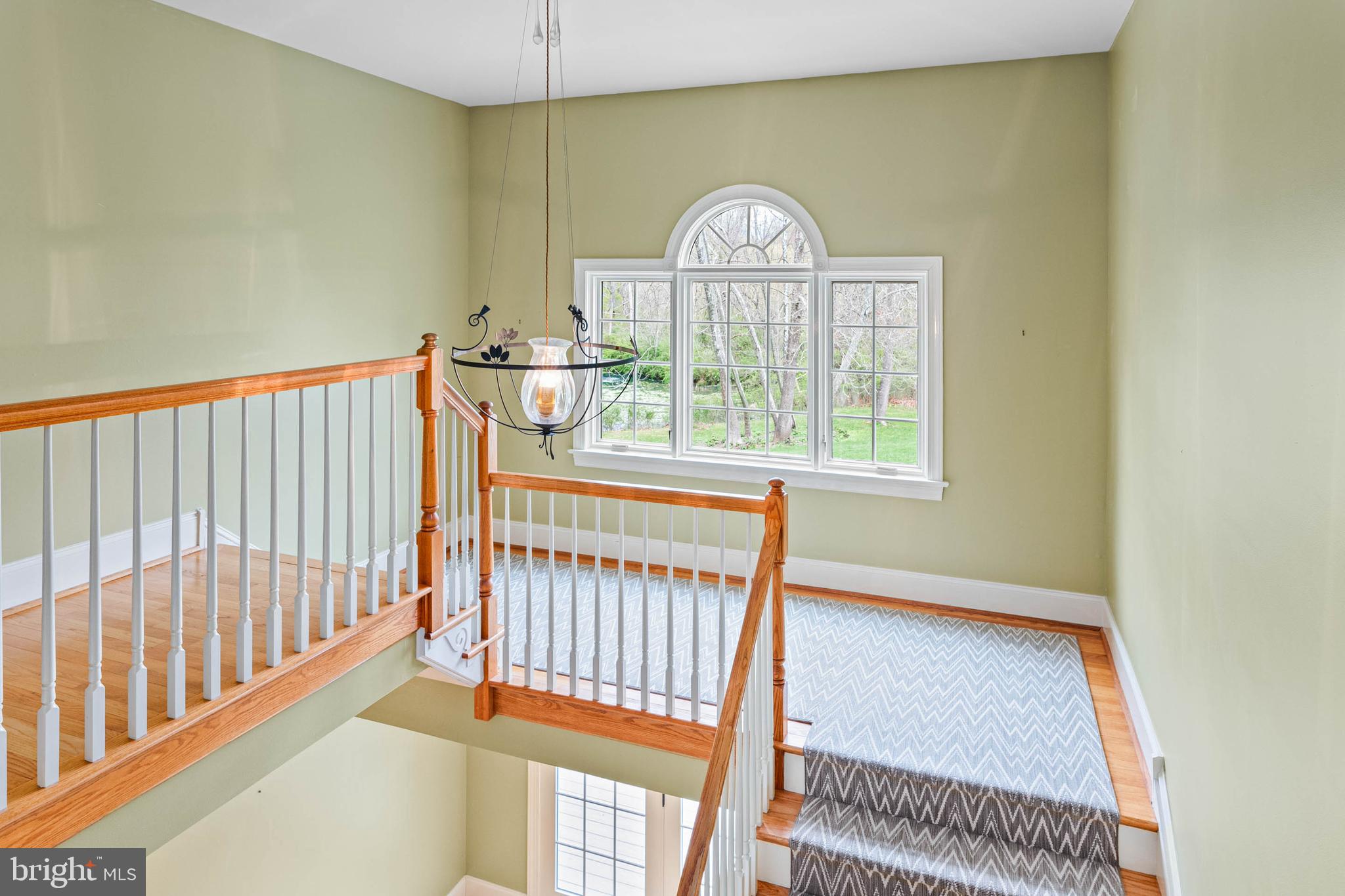 607 Newtown Road Berwyn, PA 19312 - Photo 38 of 83 a view of a bedroom with wooden floor & a window