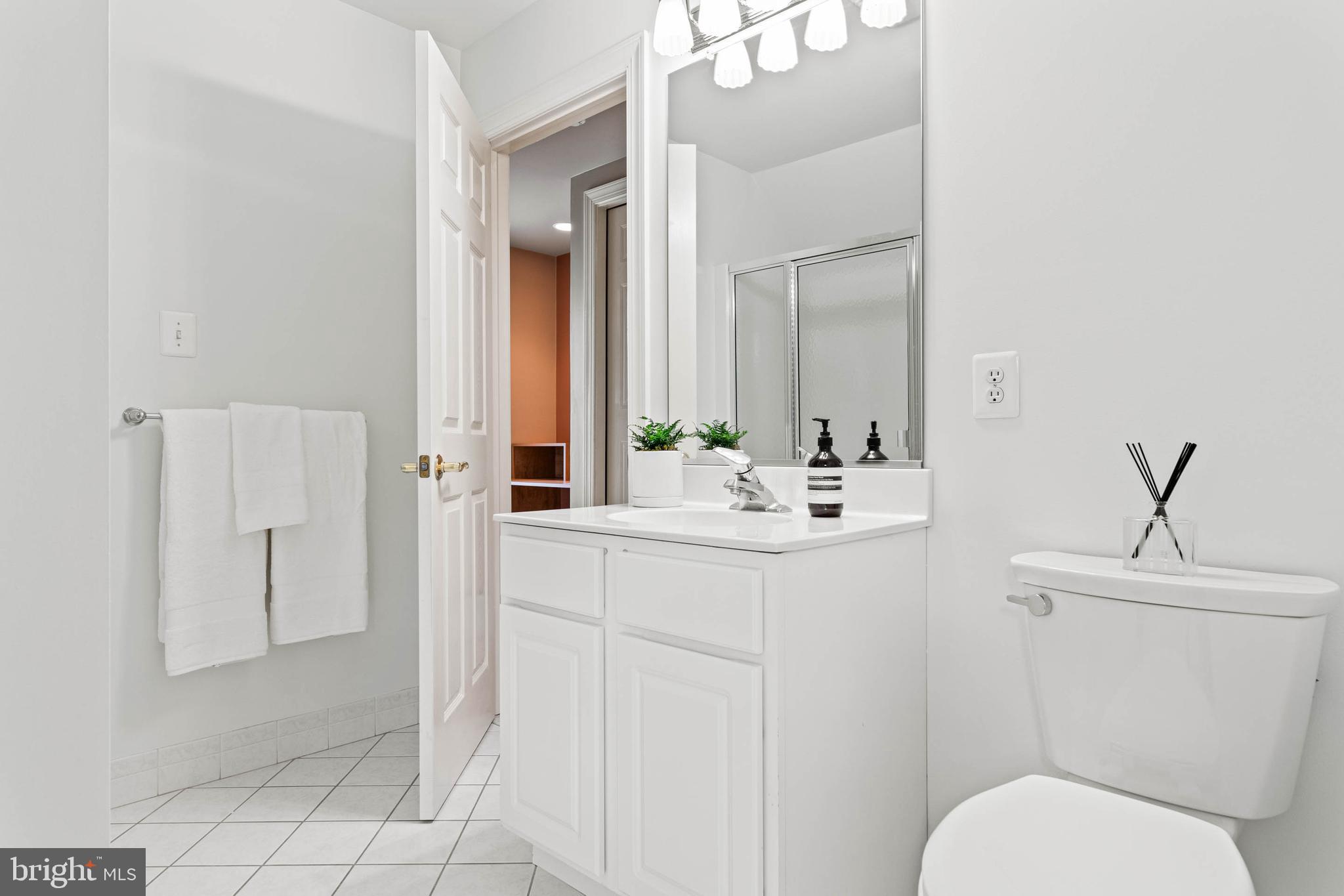 607 Newtown Road Berwyn, PA 19312 - Photo 51 of 83 a bathroom with a sink toilet and mirror