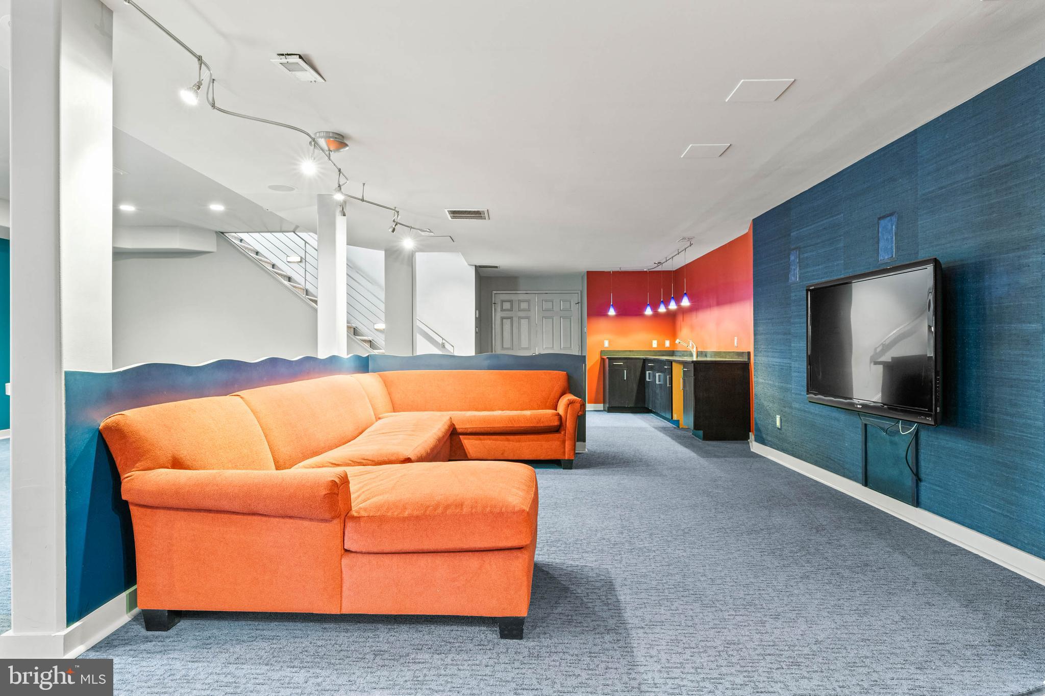 607 Newtown Road Berwyn, PA 19312 - Photo 64 of 83 a living room with furniture and a flat screen tv