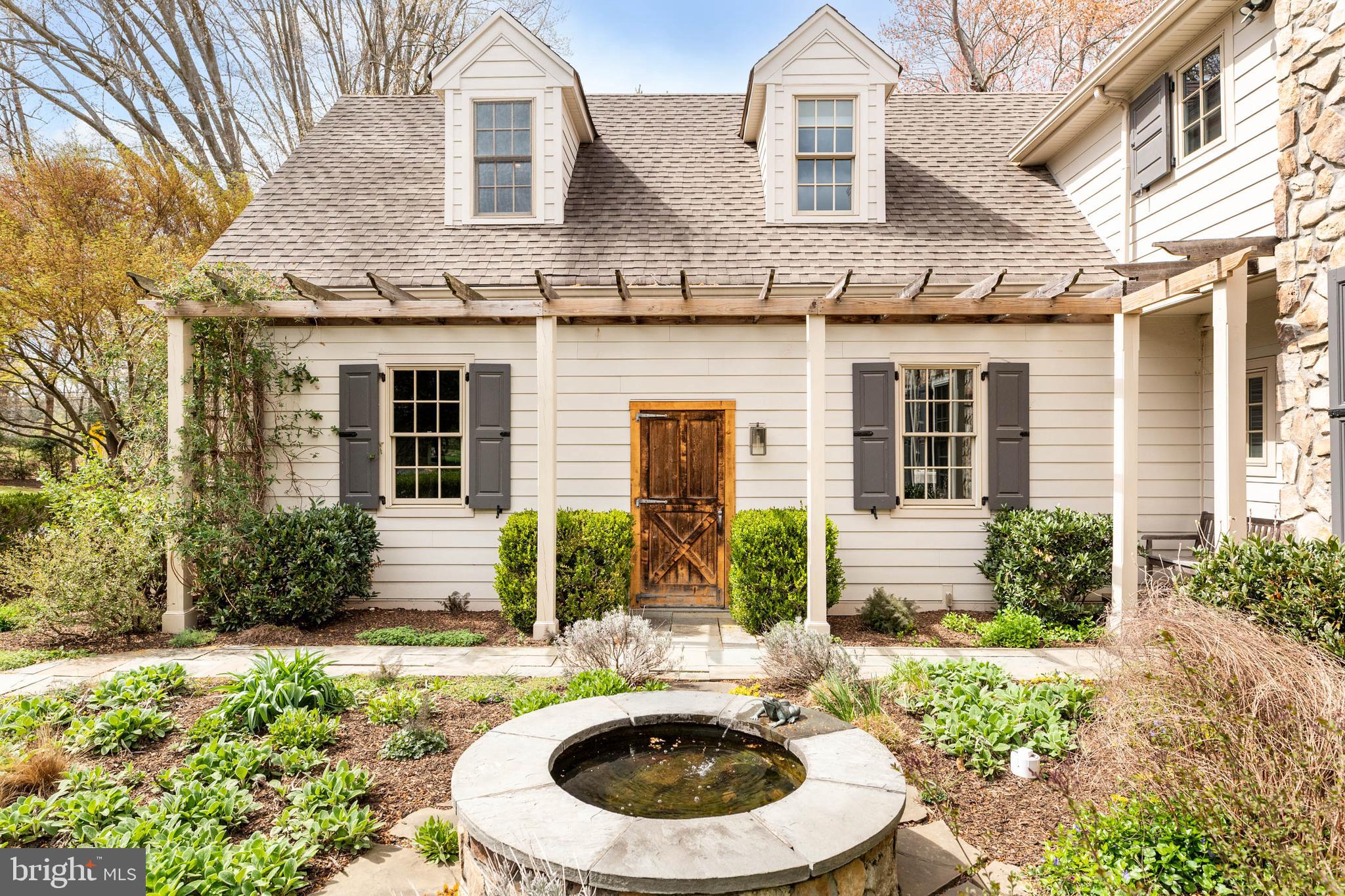 607 Newtown Road Berwyn, PA 19312 - Photo 7 of 83 a view of a house with a small yard and plants
