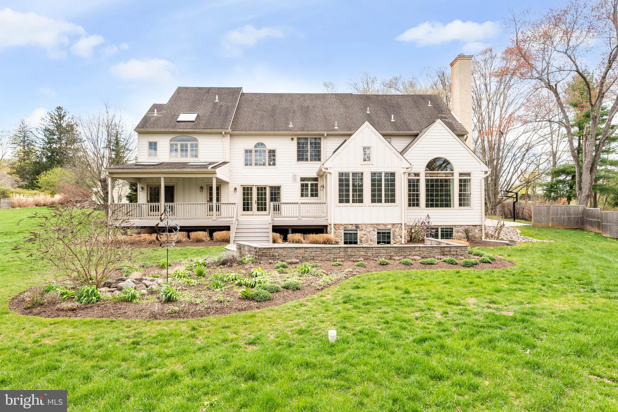 607 Newtown Road Berwyn, PA 19312 - Photo 74 of 83 a front view of a house with a garden and trees