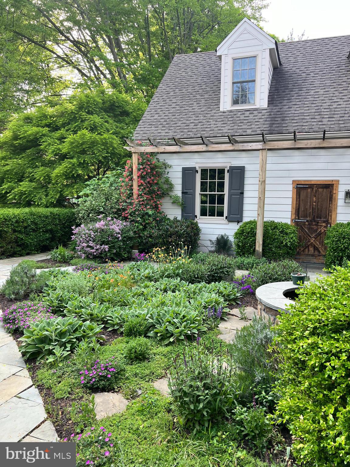607 Newtown Road Berwyn, PA 19312 - Photo 8 of 83 a front view of a house with a yard