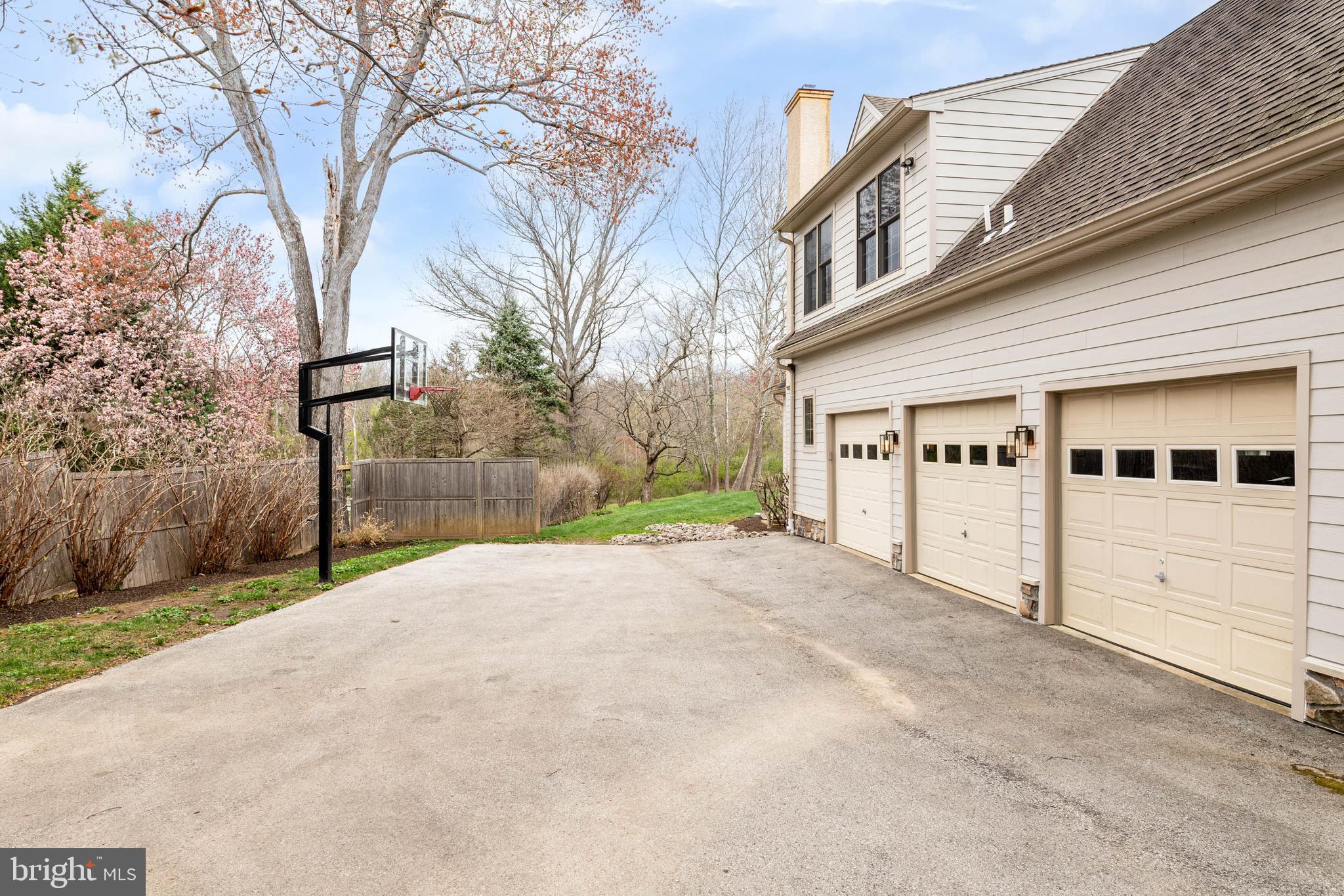 607 Newtown Road Berwyn, PA 19312 - Photo 78 of 83 a front view of a house with a yard and garage