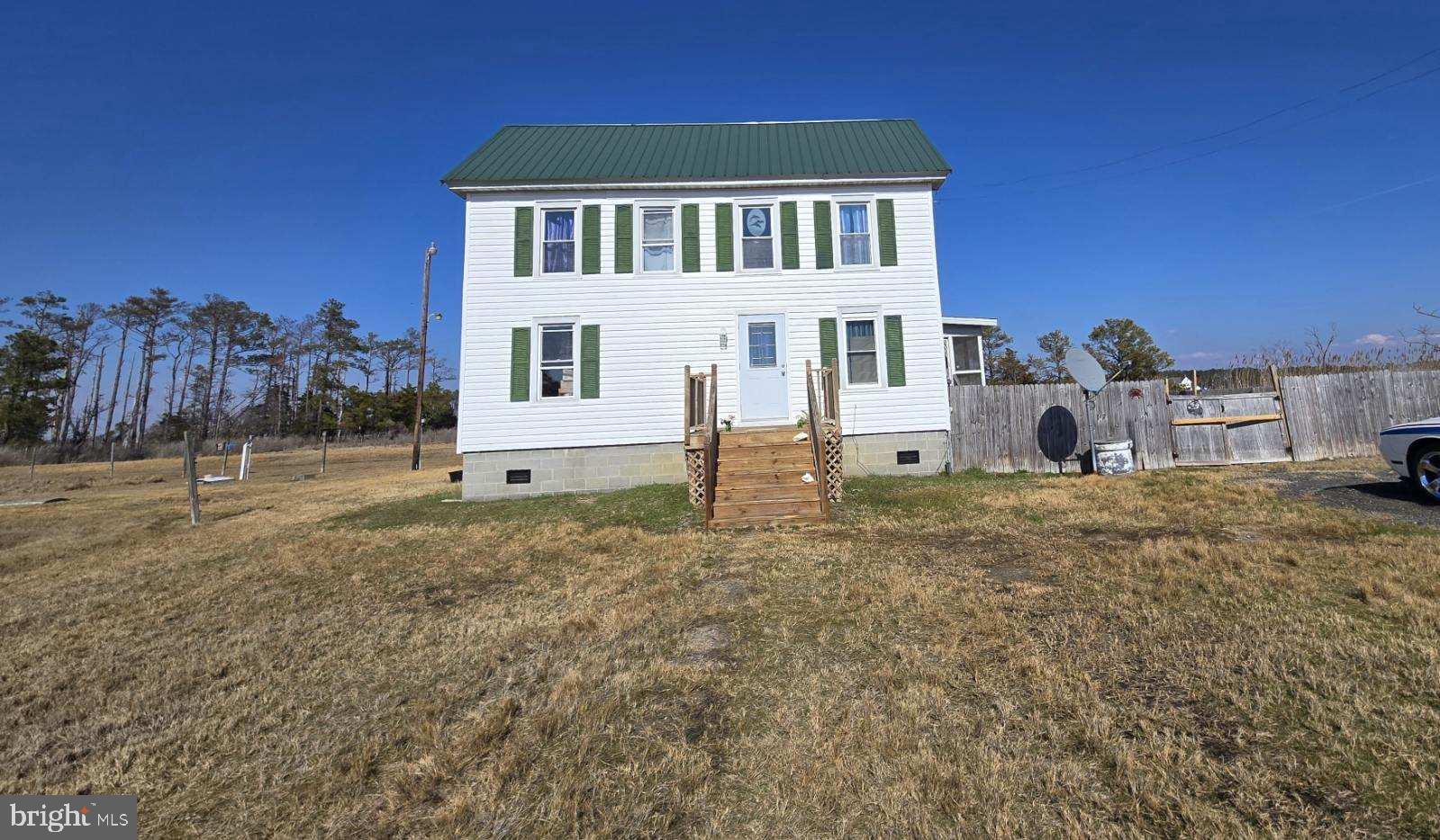 1511 Crocheron Road Crocheron, MD 21627 - Photo 36 of 55 a front view of a house with a yard