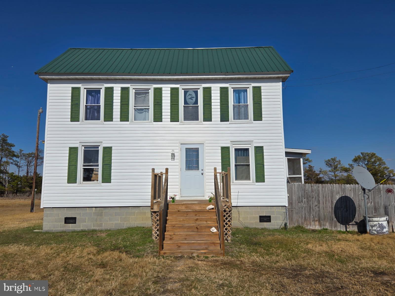1511 Crocheron Road Crocheron, MD 21627 - Photo 39 of 55 a front view of a house with garden