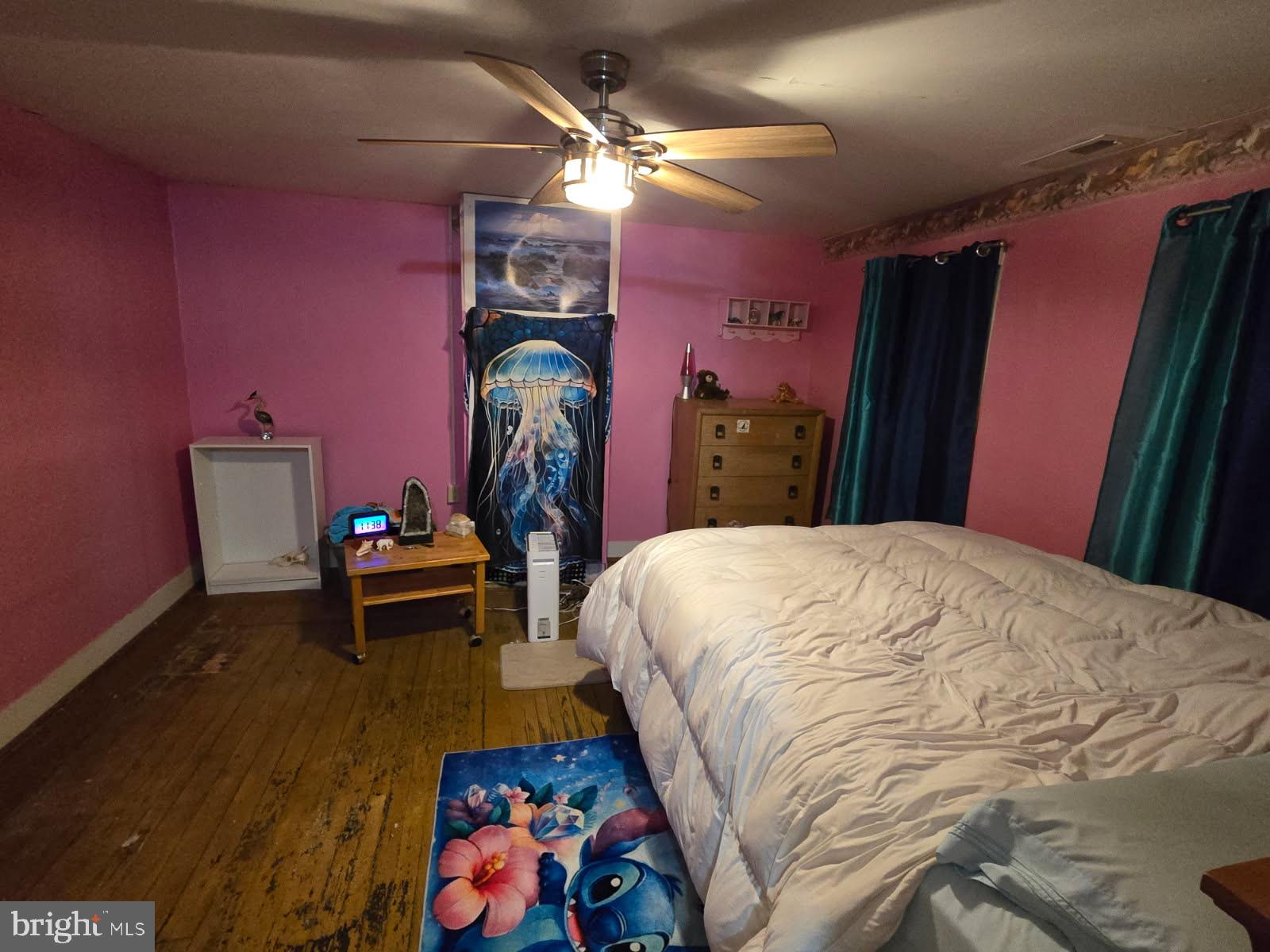 1511 Crocheron Road Crocheron, MD 21627 - Photo 55 of 55 a bed room with a bed and a chandelier