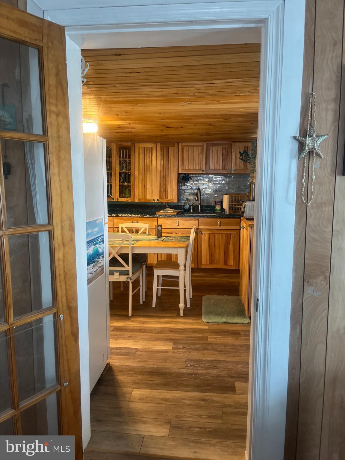 1511 Crocheron Road Crocheron, MD 21627 - Photo 6 of 55 a view of a room with wooden floor and windows