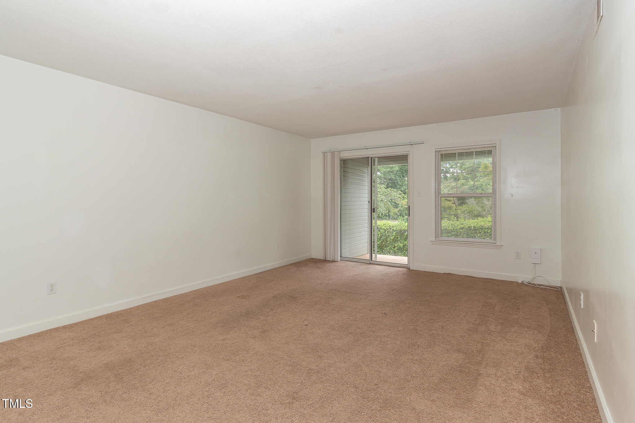 2522 Avent Ferry Road, Unit 103 Raleigh, NC 27606 - Photo 11 of 25 an empty room with windows
