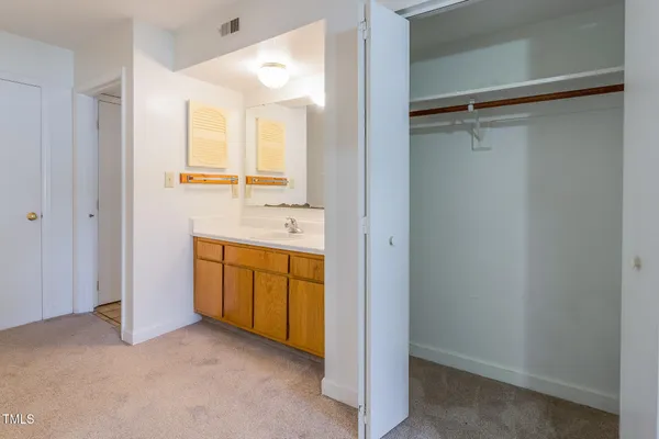 a bathroom with a granite countertop sink mirror and double