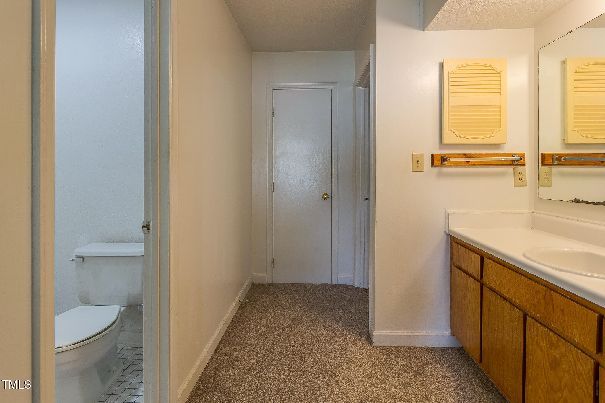 2522 Avent Ferry Road, Unit 103 Raleigh, NC 27606 - Photo 15 of 25 a bathroom with a sink and a toilet