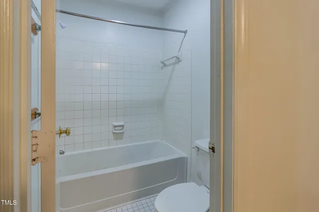 a bathroom with a shower and a toilet