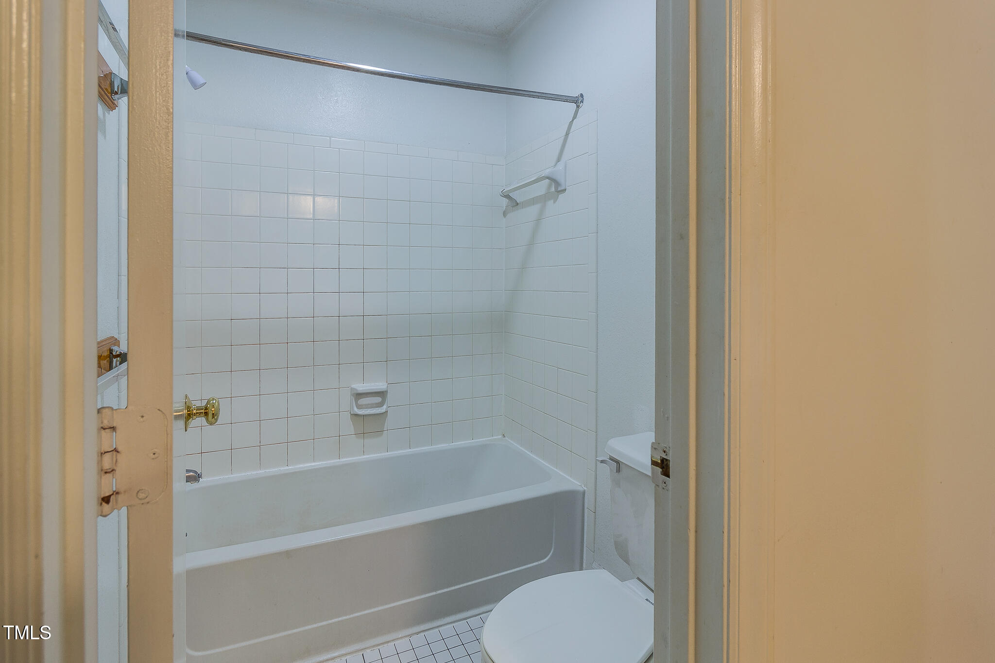 2522 Avent Ferry Road, Unit 103 Raleigh, NC 27606 - Photo 16 of 25 a bathroom with a shower and a toilet