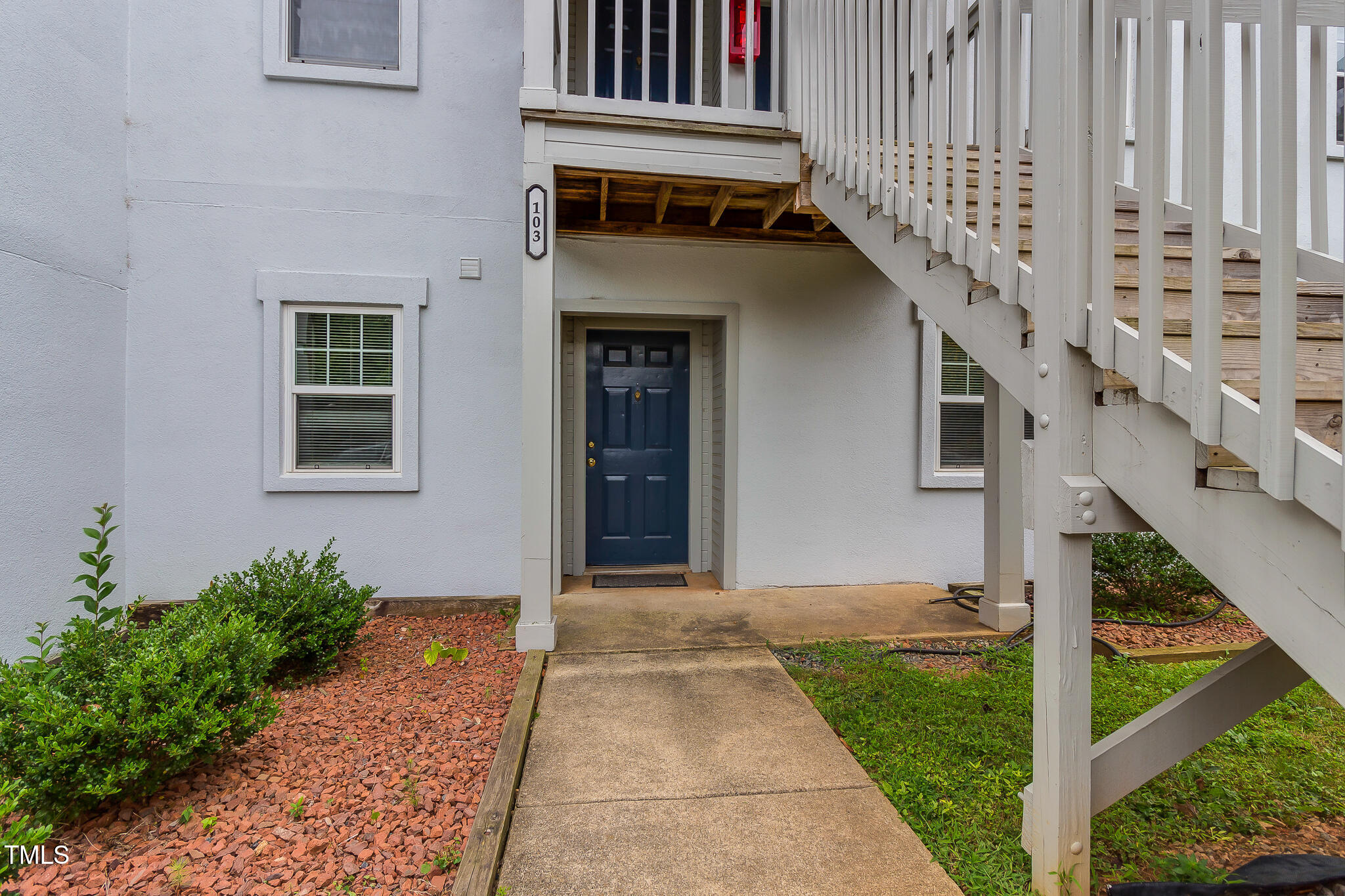 2522 Avent Ferry Road, Unit 103 Raleigh, NC 27606 - Photo 2 of 25 a front view of a house with a yard