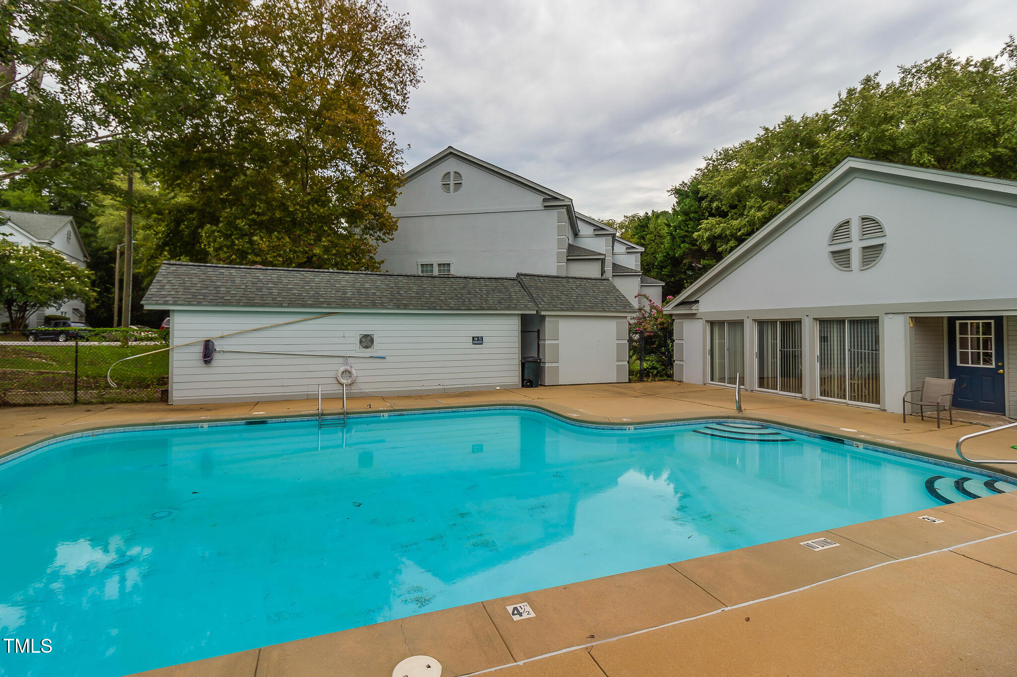 2522 Avent Ferry Road, Unit 103 Raleigh, NC 27606 - Photo 24 of 25 a view of a house with pool and a yard