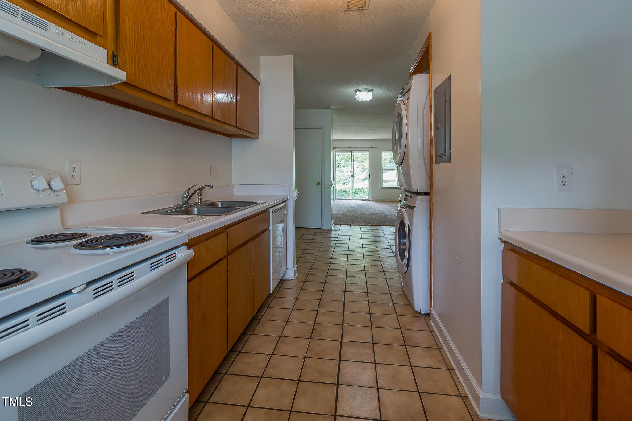 2522 Avent Ferry Road, Unit 103 Raleigh, NC 27606 - Photo 5 of 25 a kitchen with a sink a stove cabinets and a wooden floor
