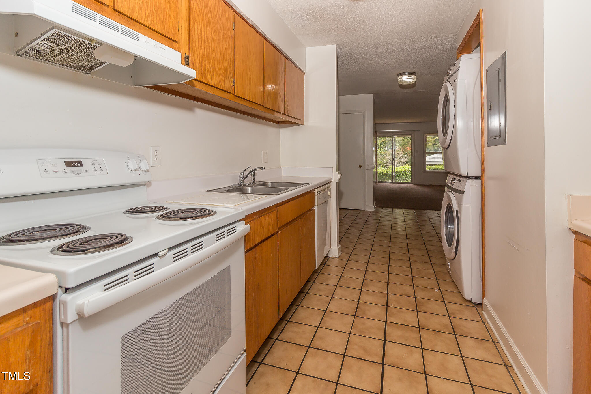 2522 Avent Ferry Road, Unit 103 Raleigh, NC 27606 - Photo 9 of 25 a kitchen with a stove top oven and cabinets