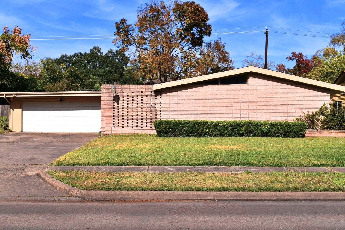 5126 Beechnut Street Houston, TX 77096 - Photo 2 of 20 a view of a yard with a wooden fence