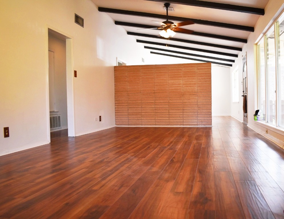 5126 Beechnut Street Houston, TX 77096 - Photo 3 of 20 a view of empty room with wooden floor and windows