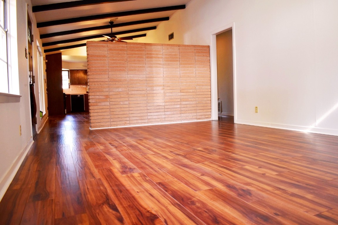 5126 Beechnut Street Houston, TX 77096 - Photo 4 of 20 a view of empty room with wooden floor