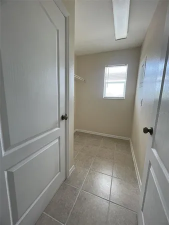 a view of an empty room with a window