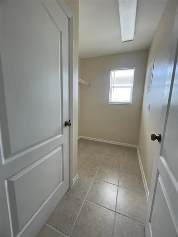 a view of an empty room with a window