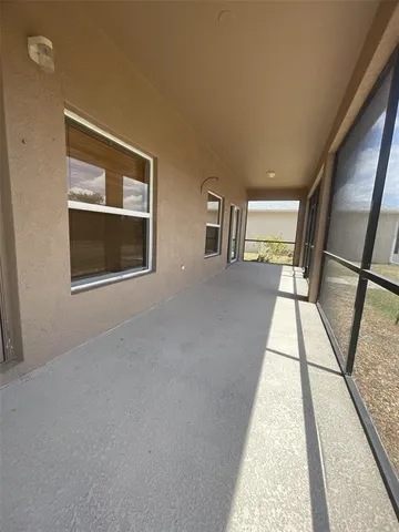 a view of an empty room with windows