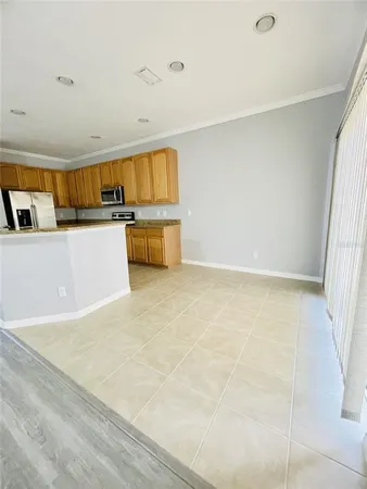 a view of kitchen with sink and cabinets