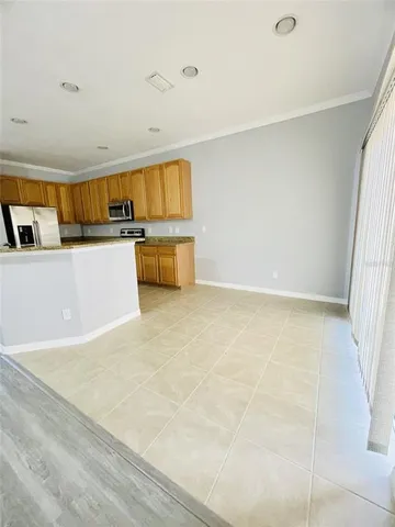 a view of kitchen with sink and cabinets