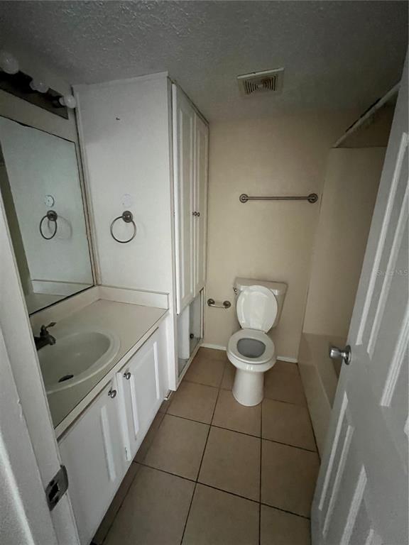 136 Blue Pointe Way, Unit 310 Altamonte Springs, FL 32701 - Photo 7 of 10 a bathroom with a granite countertop sink mirror and toilet