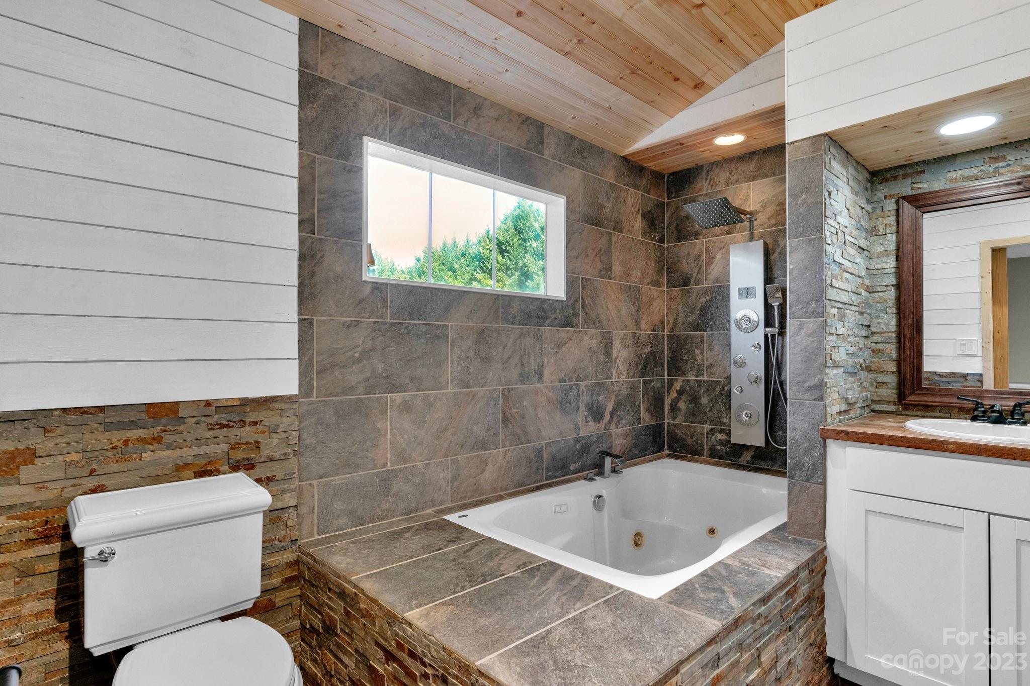 7861 Fisher Road Mount Pleasant, NC 28124 - Photo 26 of 48 a bathroom with a sink a toilet and bathtub