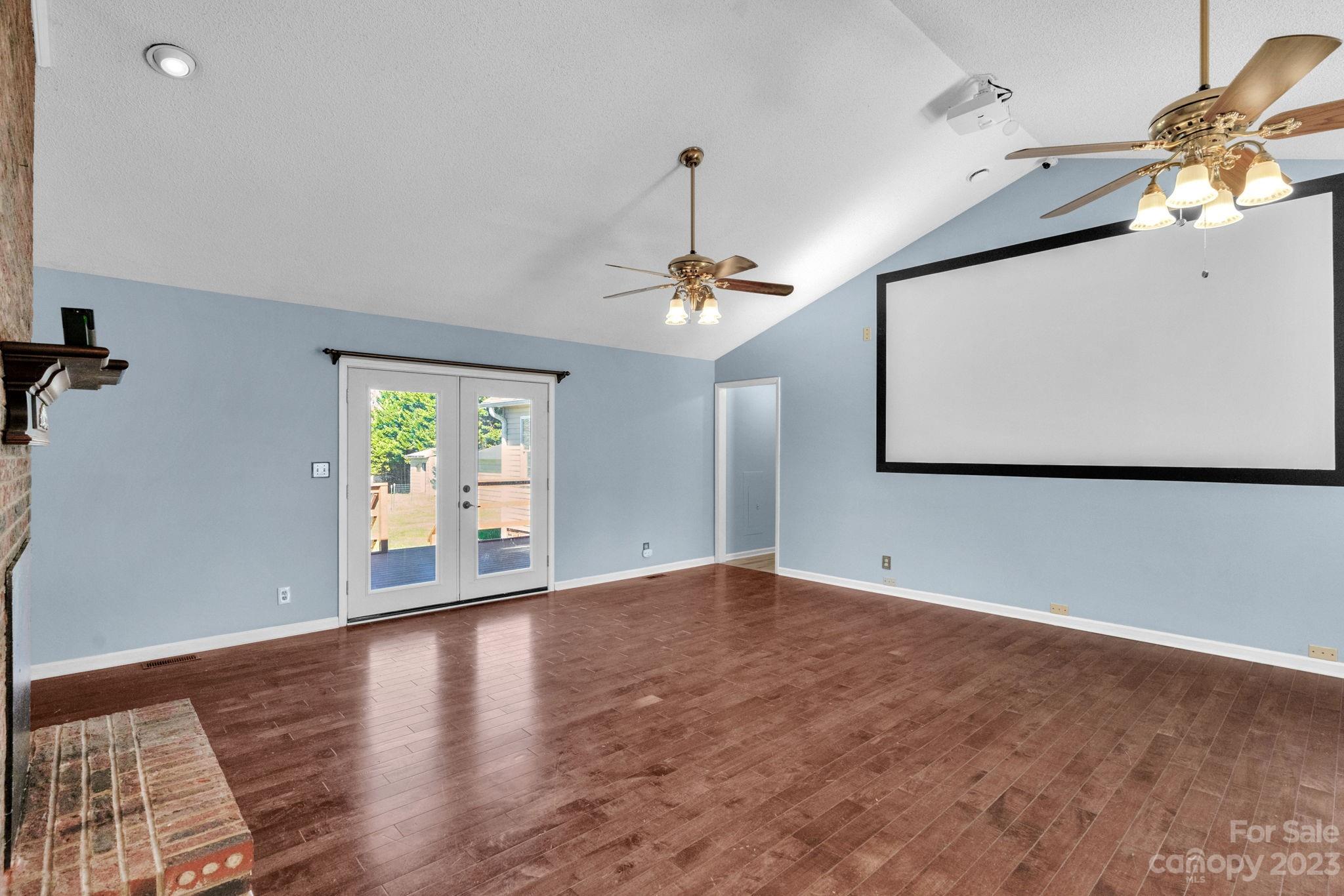 7861 Fisher Road Mount Pleasant, NC 28124 - Photo 5 of 48 a view of a livingroom with wooden floor and a ceiling fan