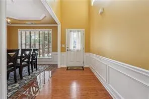 a spacious bathroom with a granite countertop shower a sink and a mirror