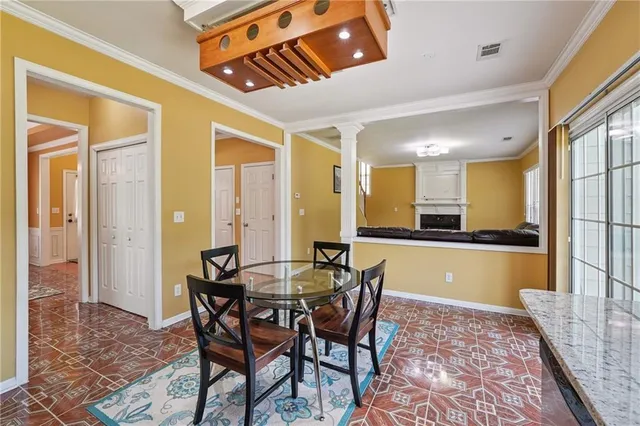 a dining room with furniture and a window