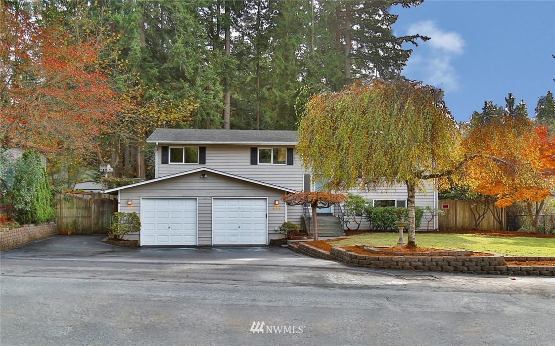 404 170th Place Southwest Bothell, WA 98012 - Photo 1 of 25 a front view of house with yard and trees around