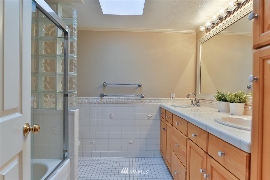 404 170th Place Southwest Bothell, WA 98012 - Photo 12 of 25 a spacious bathroom with a shower sink and mirror