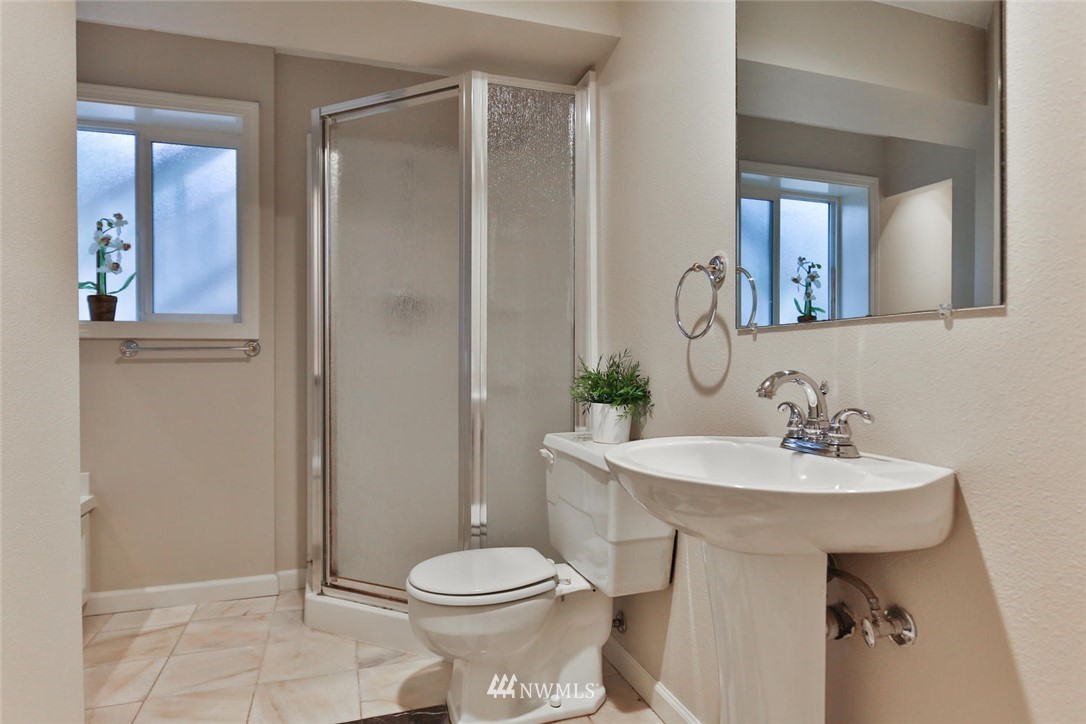 404 170th Place Southwest Bothell, WA 98012 - Photo 20 of 25 a bathroom with a sink toilet and mirror