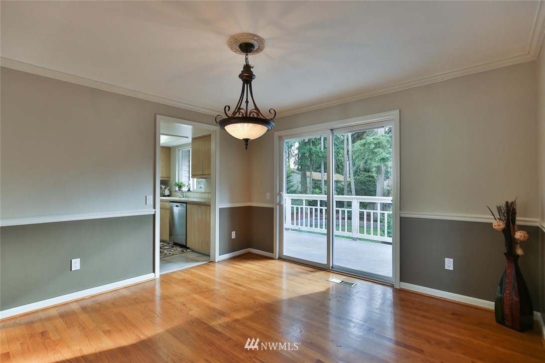 404 170th Place Southwest Bothell, WA 98012 - Photo 10 of 25 a view of a room with window hardwood floor and a ceiling fan