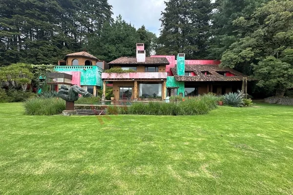 a front view of a house with a yard table and chairs
