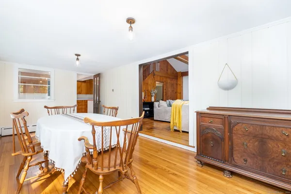 a dining room with furniture and window