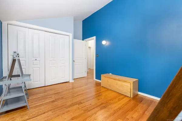a view of room with wooden floor